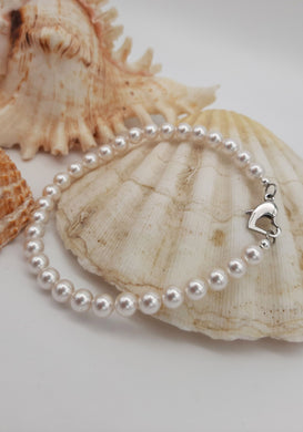 Bracciale di Perle bianche Swarovski  e acciaio, semplice ed elegante 